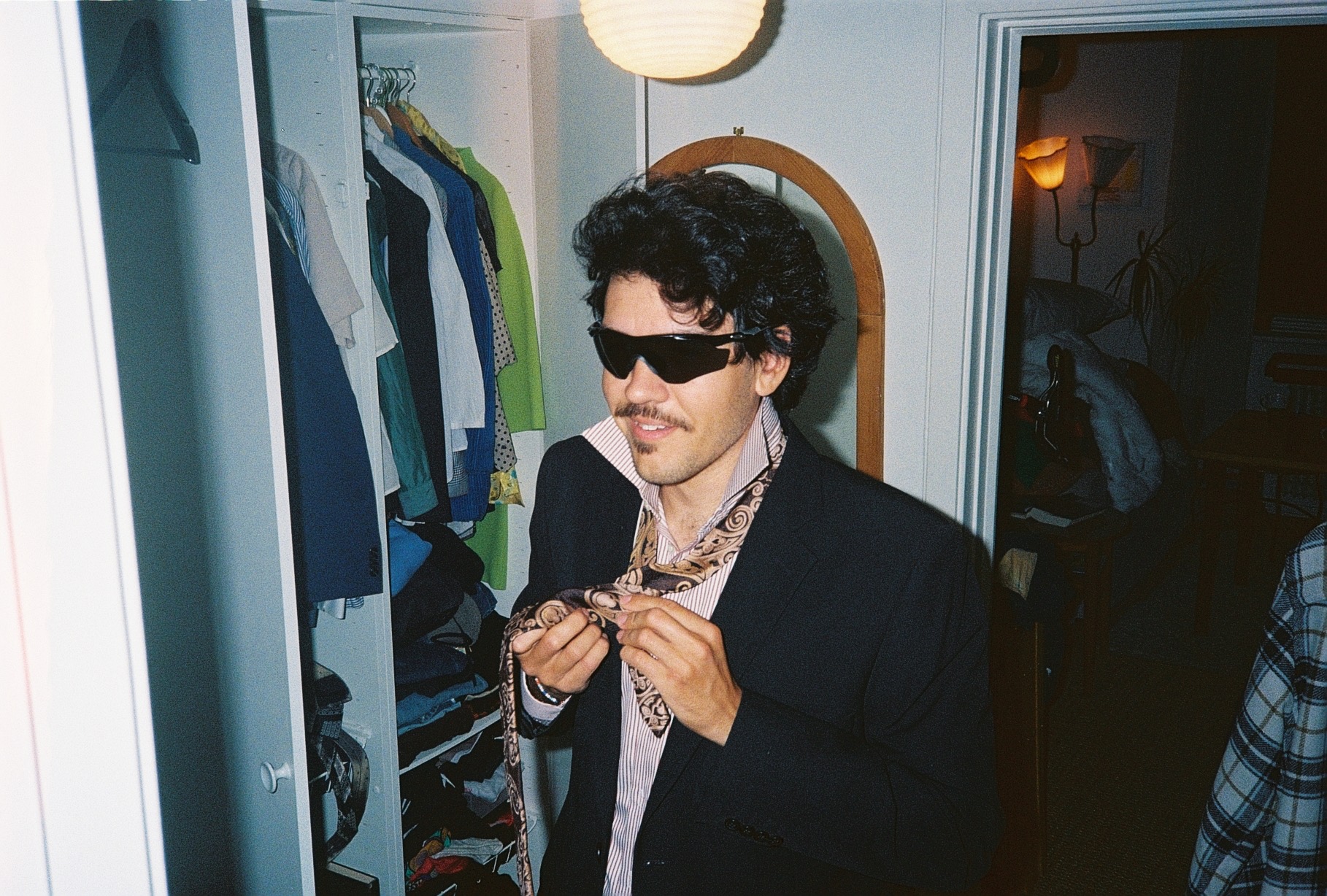 Isaac tying his tie